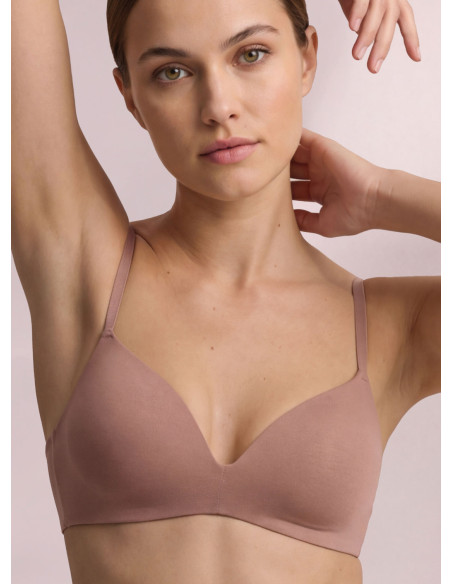 Infiore Naturalfit wireless triangle bra in caramel with smooth cups and bonded edges worn by a model