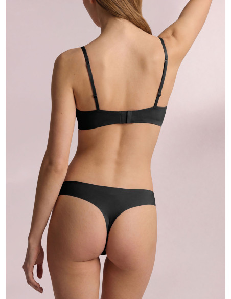Infiore Naturalfit seamless brazilian brief in black bonded cotton worn by a model, back view.