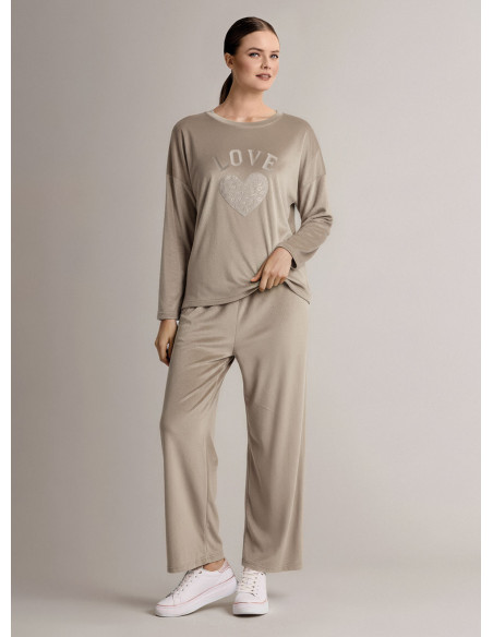 Tuta girocollo in velour morbido e luminoso con maglia a maniche lunghe e pantalone lungo palazzo