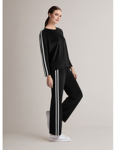 Tuta girocollo in velour morbido e luminoso con maglia a maniche lunghe e pantalone lungo palazzo