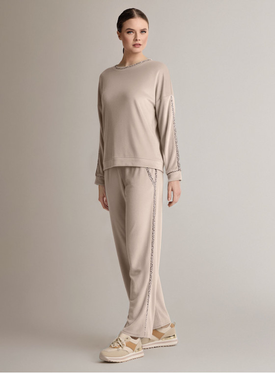 Tuta girocollo in velour morbido e luminoso con maglia a maniche lunghe e pantalone lungo palazzo