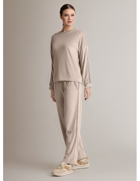 Tuta girocollo in velour morbido e luminoso con maglia a maniche lunghe e pantalone lungo palazzo